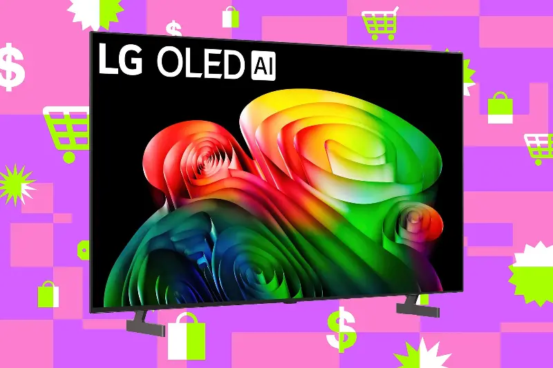 An image composition of LG’s 65-inch B6 OLED TV sitting on a background consisting of multiple colors and symbols. This one’s a mix of purple and pink, with neon green and white shopping cart symbols, mixed with price tags and US cash signs.