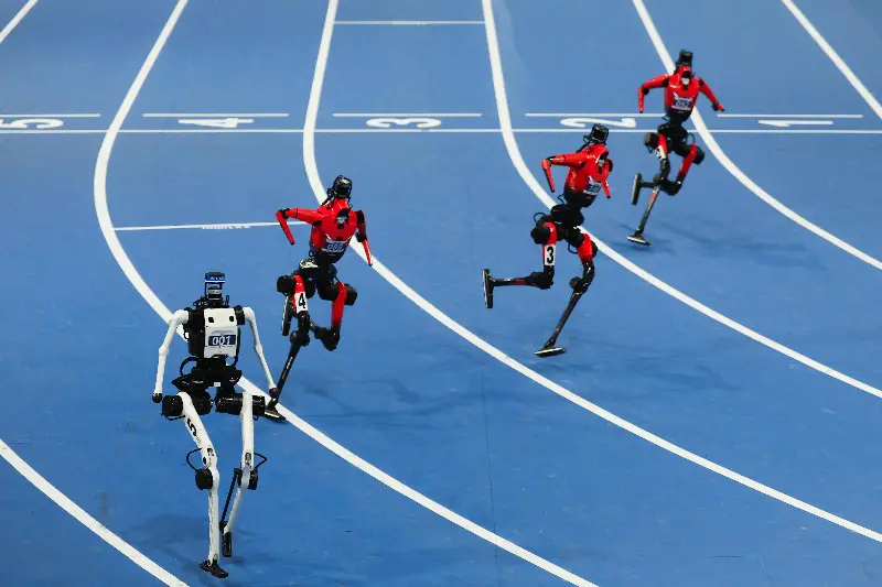 Humanoid robot "Tiangong" (L) crossing the finish line in the 400m Large Group final during day two of the 2nd World Humanoid Robot Games at National Speed Skating Oval on August 22, 2026 in Beijing, China.