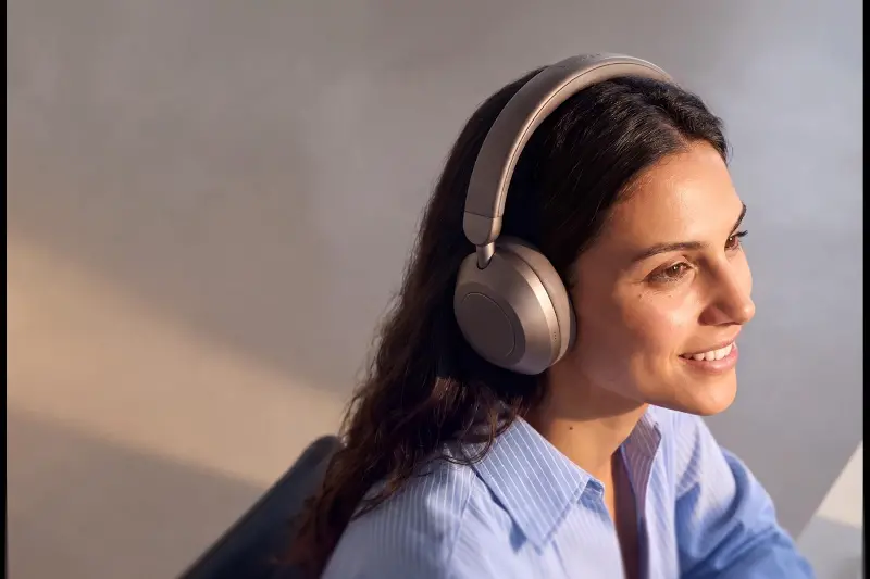 A woman wearing the Soundcore Space 2 Pro headphones.