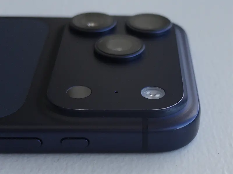 My deep blue iPhone 17 Pro, showing the worn anodization at the corner of the camera plateau.