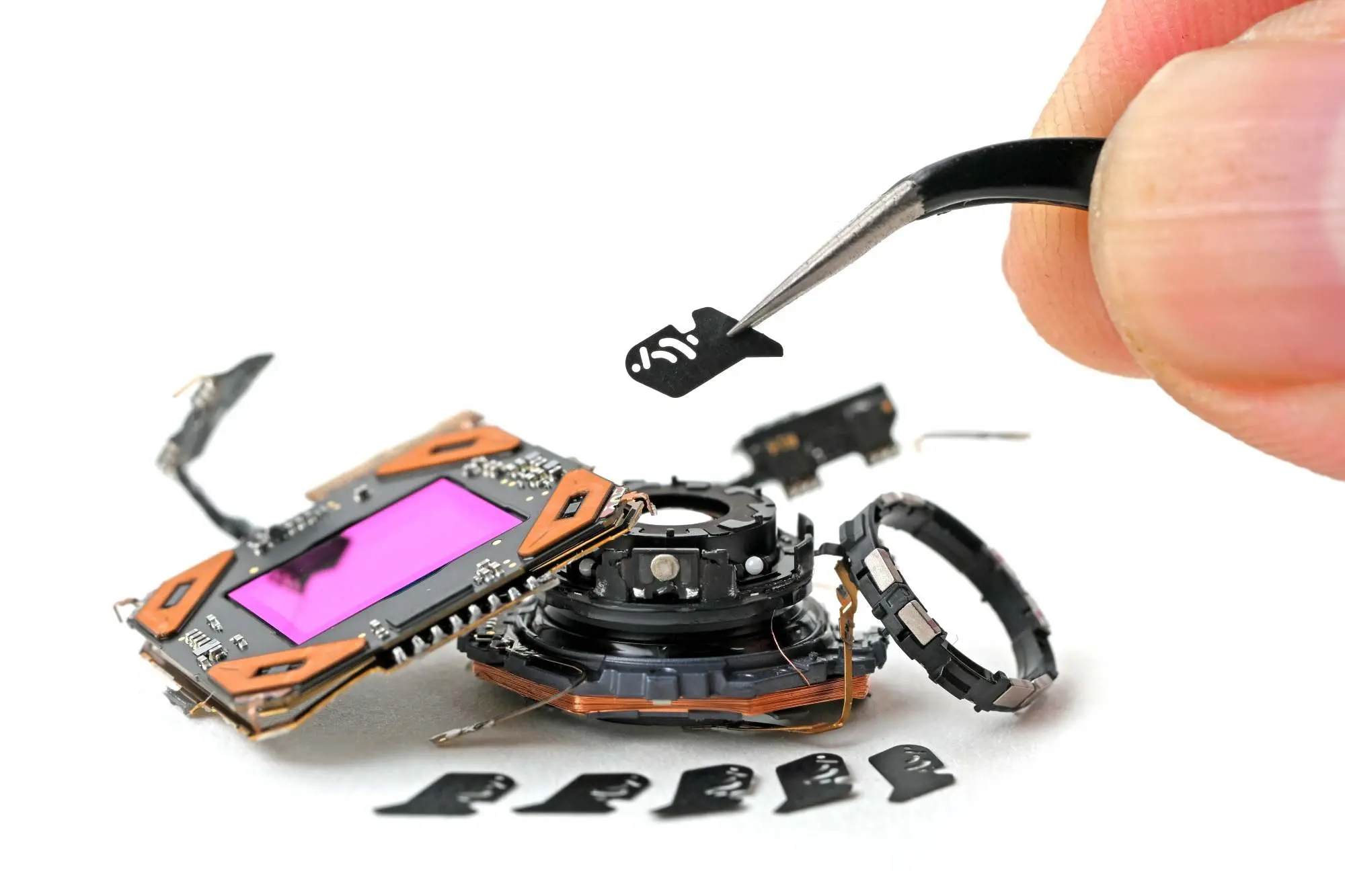 A close up photograph of an iPhone 18 Pro’s dissassemled main camera.