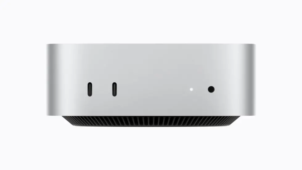 Mac mini 的正面视图,展示 2 个支持 USB 3 的 USB-C 端口和一个耳机插孔。