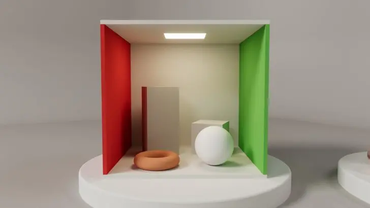 A 3D-rendered Cornell box features a white sphere, an orange torus, a gray rectangular block, and a cube with red and green walls, under a ceiling light.