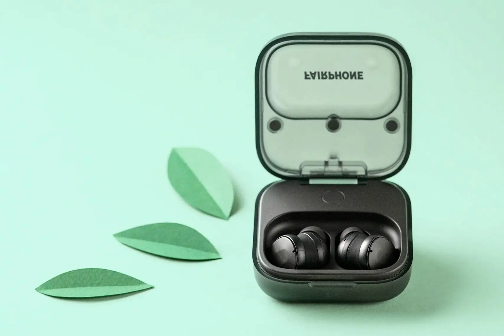 The original Fairphone Fairbuds in their charging case.