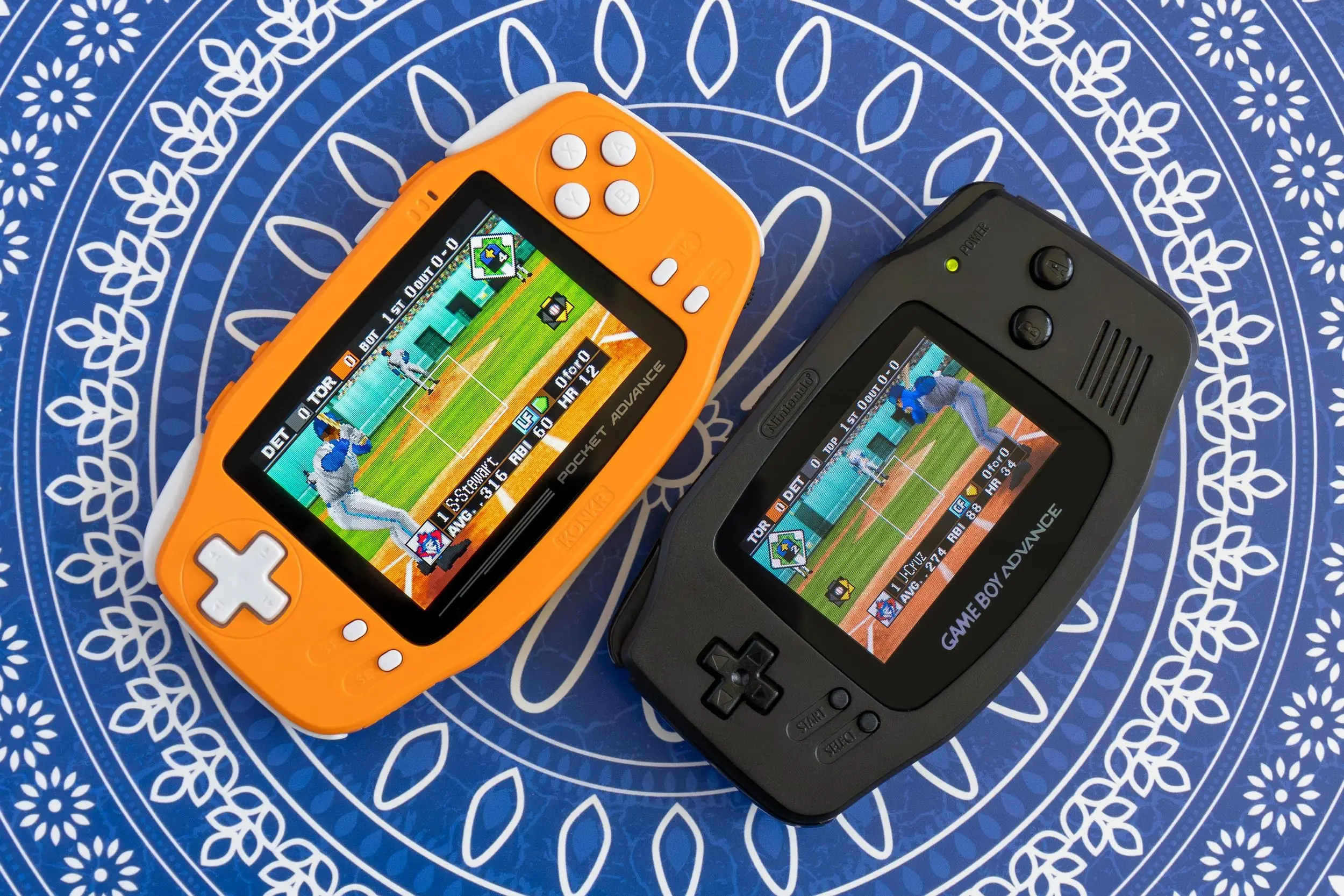 The Ayaneo Konkr Pocket Advance sitting next to an upgraded original Game Boy Advance.