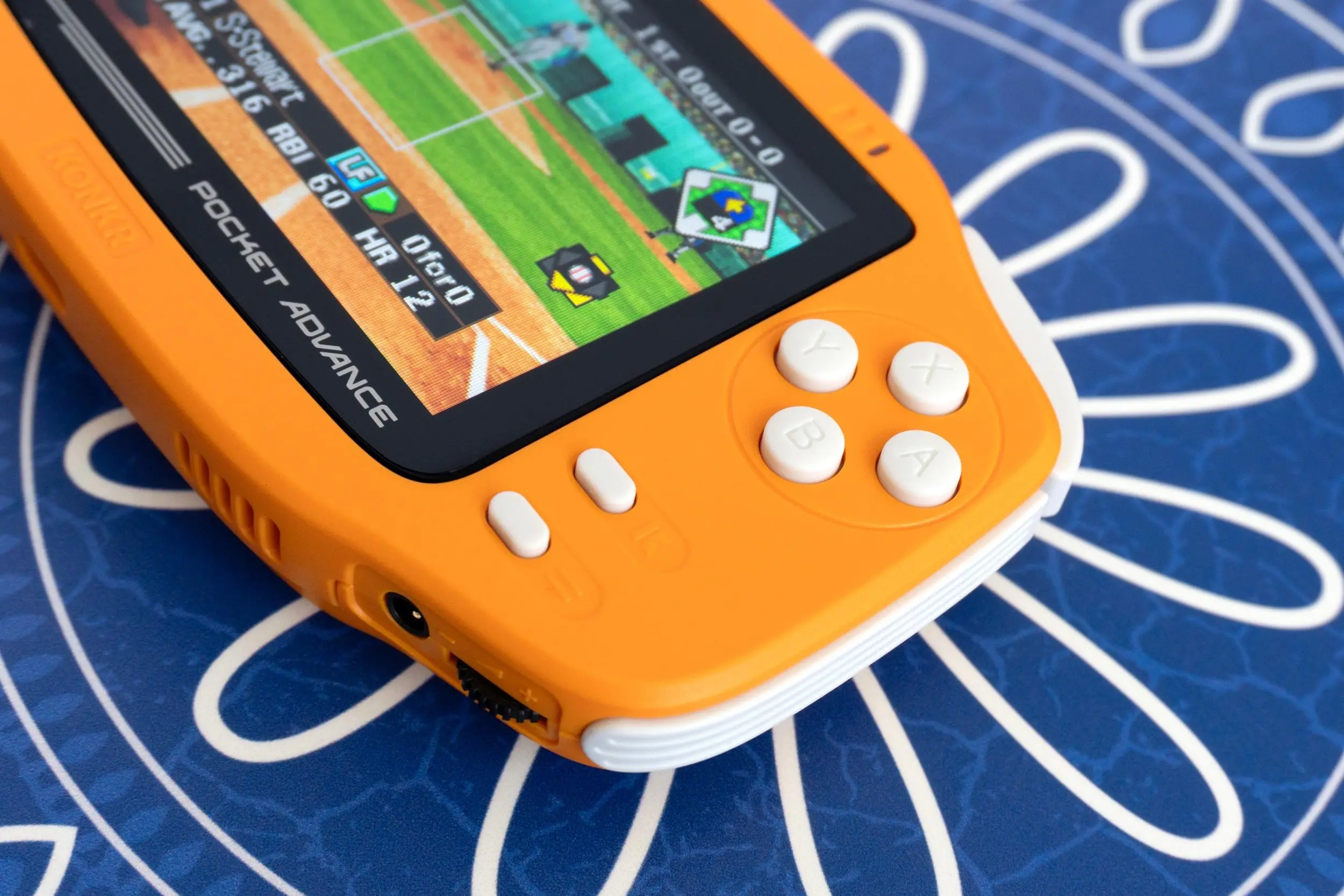 A close-up of the right side buttons on the Ayaneo Konkr Pocket Advance handheld.