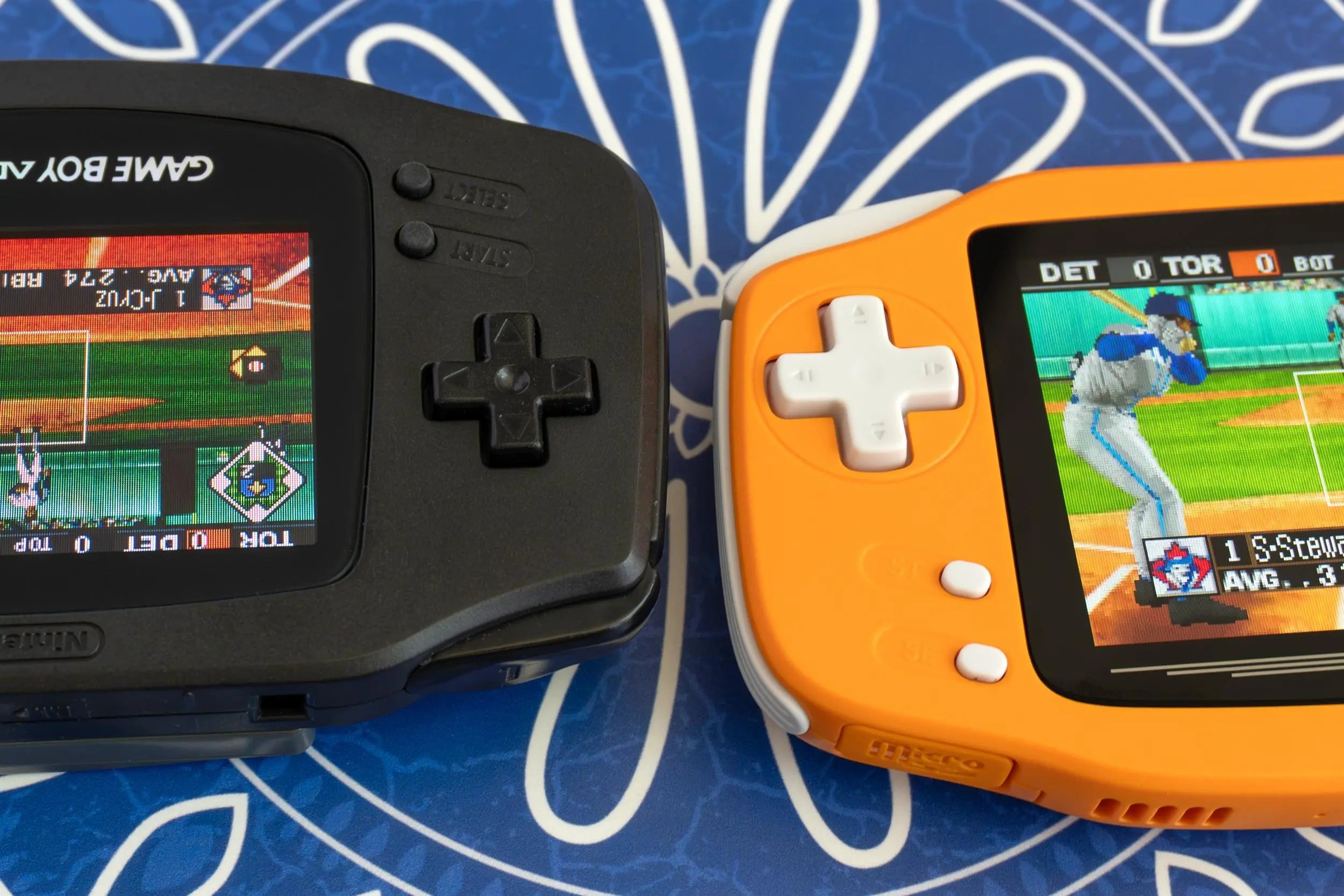 A close-up of the Ayaneo Konkr Pocket Advance’s larger D-pad next to a Game Boy Advance.