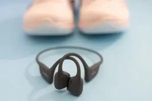 Picture of Shokz OpenRun Pro 2 in front of sneakers