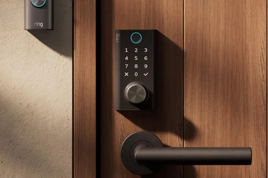 The Amazon Ring Smart Lock attached to a wooden door.