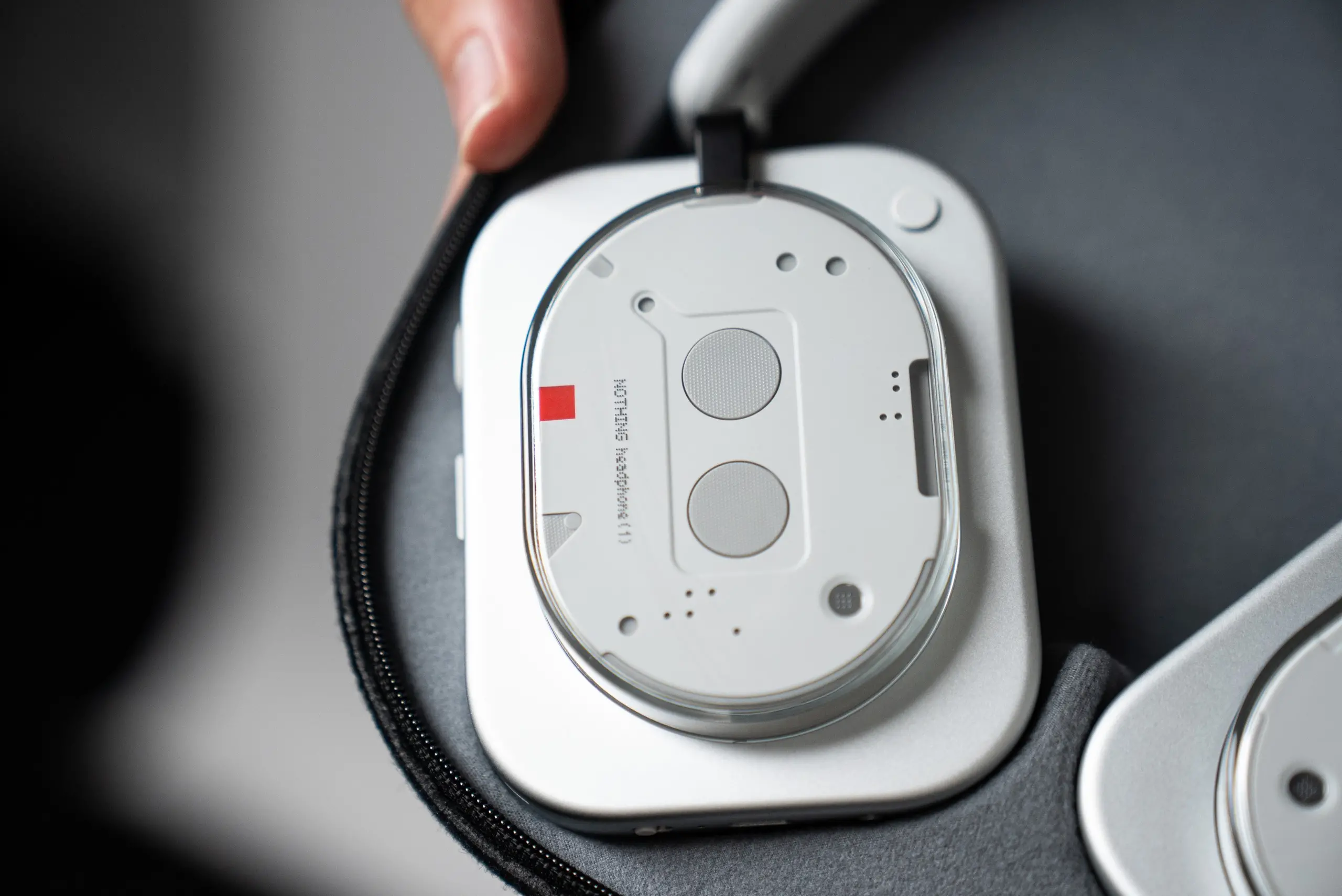 A view of the outside of the right ear of the Nothing Headphones.