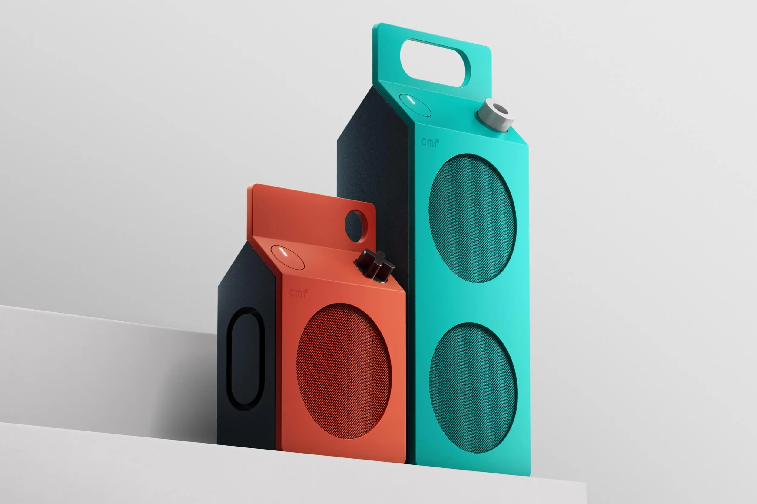 The CMF Speaker S and Speaker M standing side by side in orange and turquoise color options.