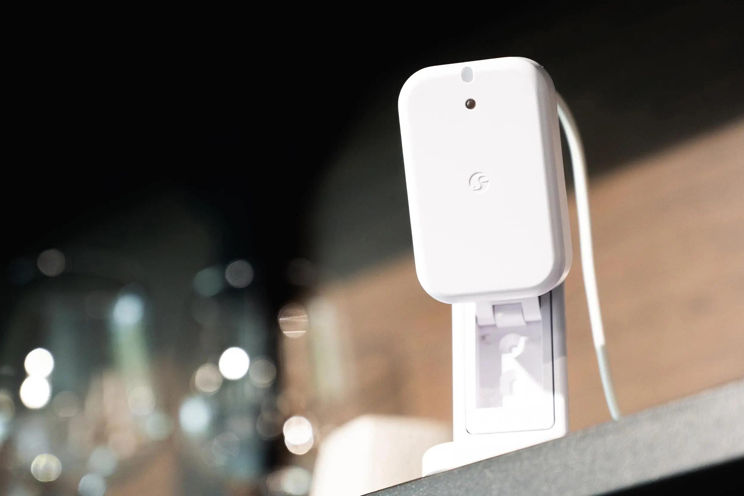 The Shelky Presence Gen4 sensor sitting on a shelf using its built-in stand.