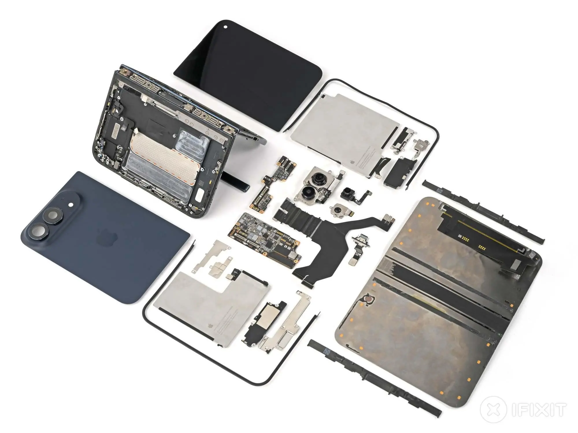iPhone Duo disassembled and all its components laid out on a white table.