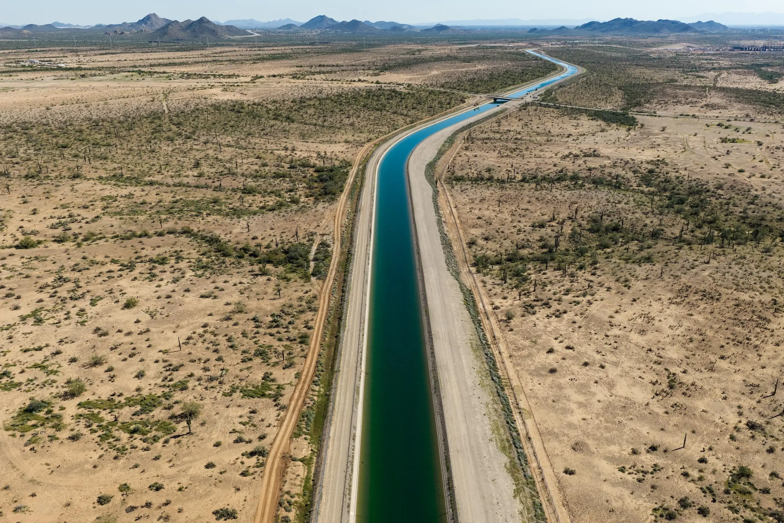 An irrigation canal stretches into the horizon.