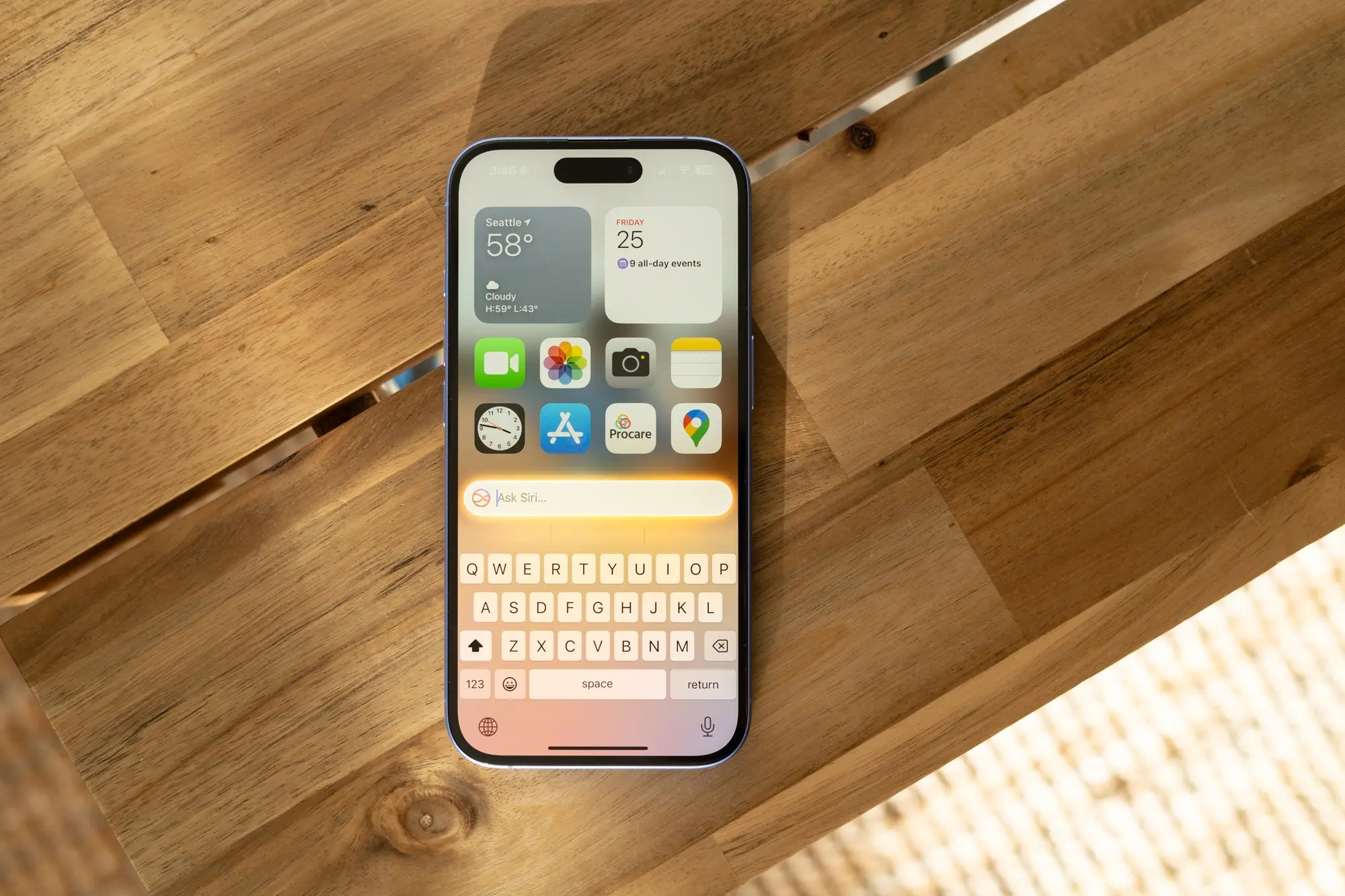 Image of iPhone 16 running iOS 18.1 with Apple Intelligence on a bench.